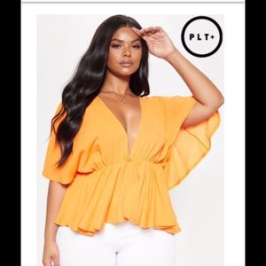 Orange peplum shirt